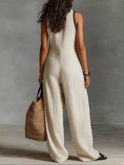 Gaia | Tuta beige smanicata con scollo profondo e gamba larga